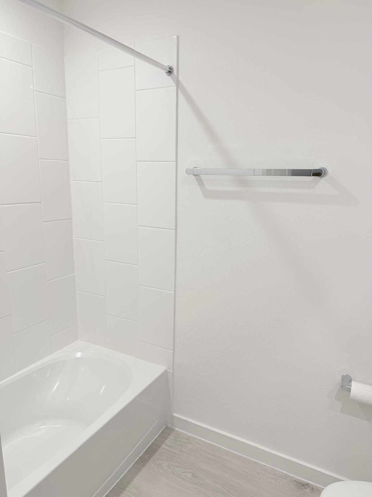 5111 Hunters Trail Fresno, TX 77545 - Photo 14 of 16 a bathroom with a bathtub and a shower