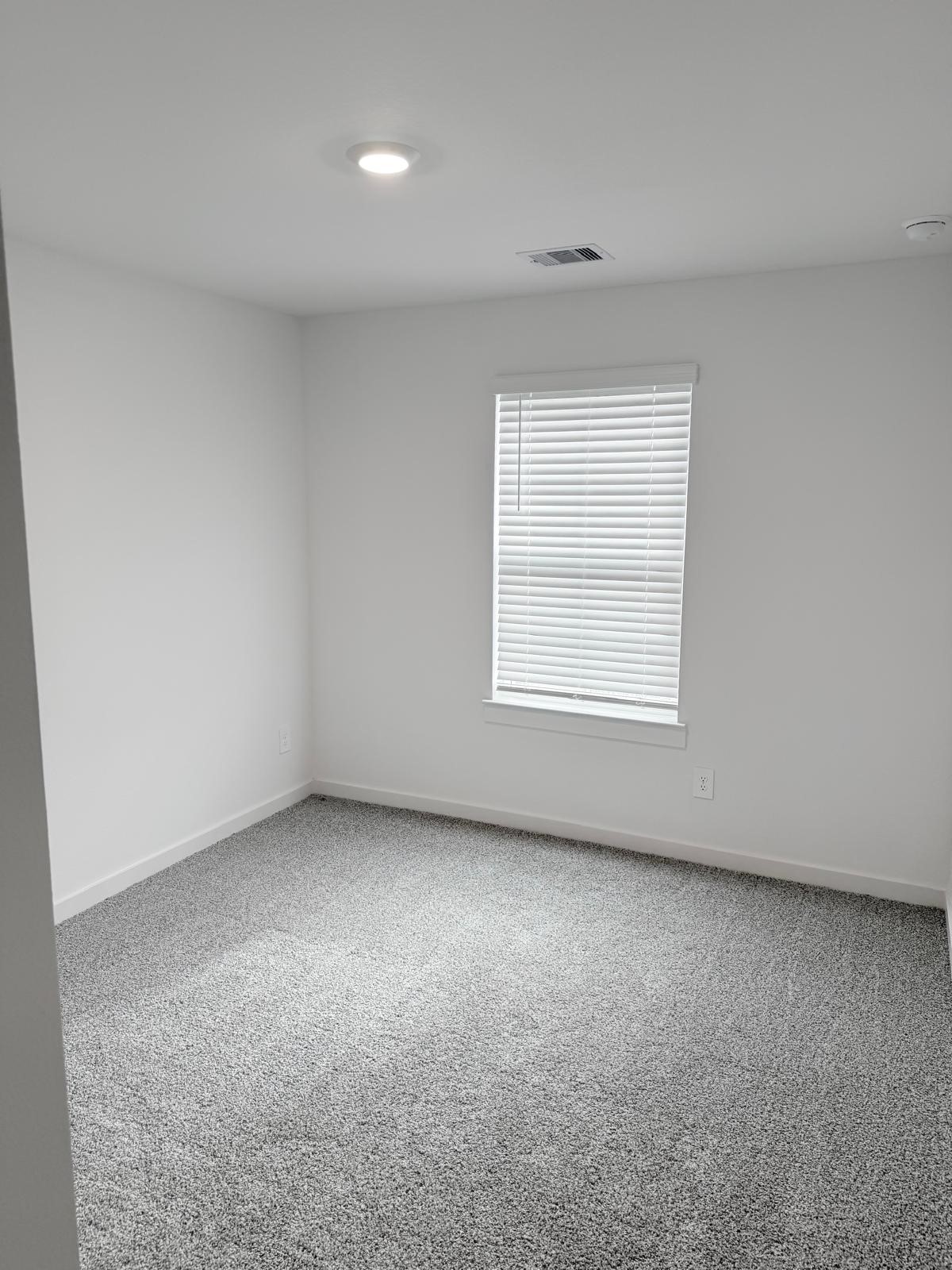5111 Hunters Trail Fresno, TX 77545 - Photo 15 of 16 an empty room with a window
