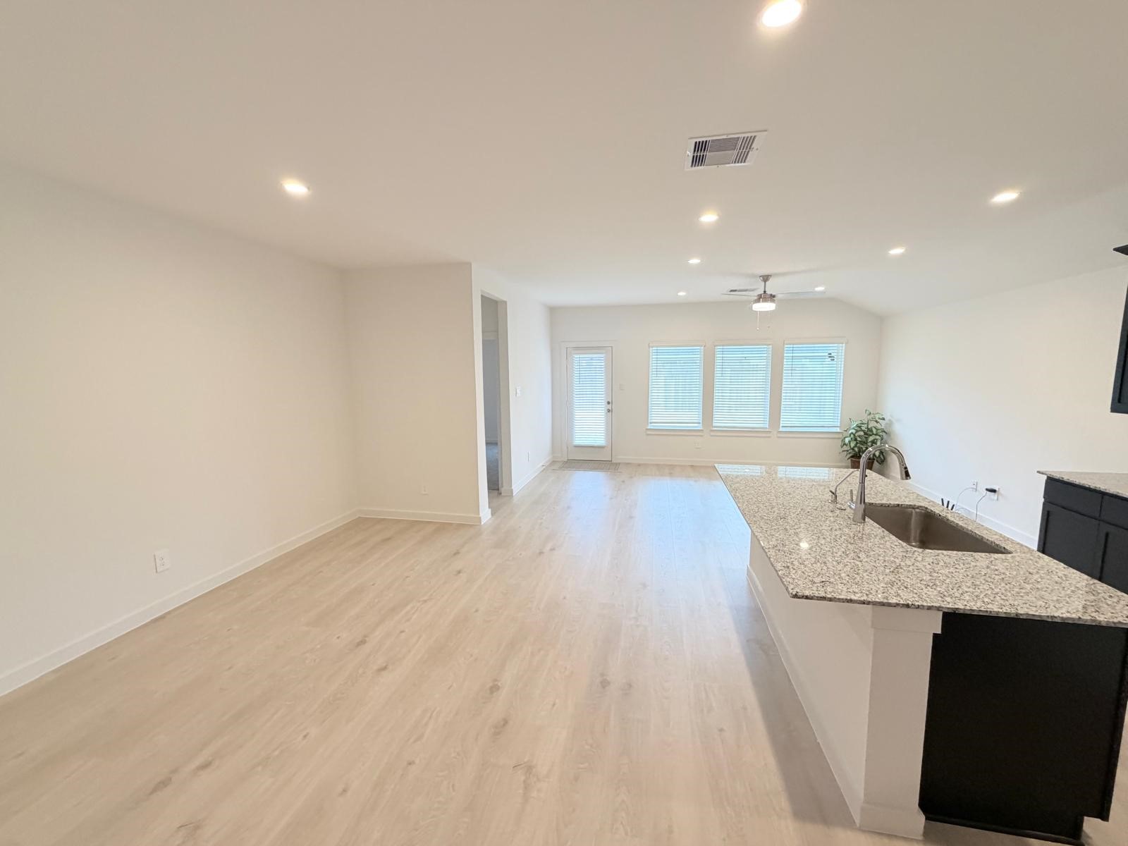 5111 Hunters Trail Fresno, TX 77545 - Photo 7 of 16 a view of kitchen and hall with wooden floor