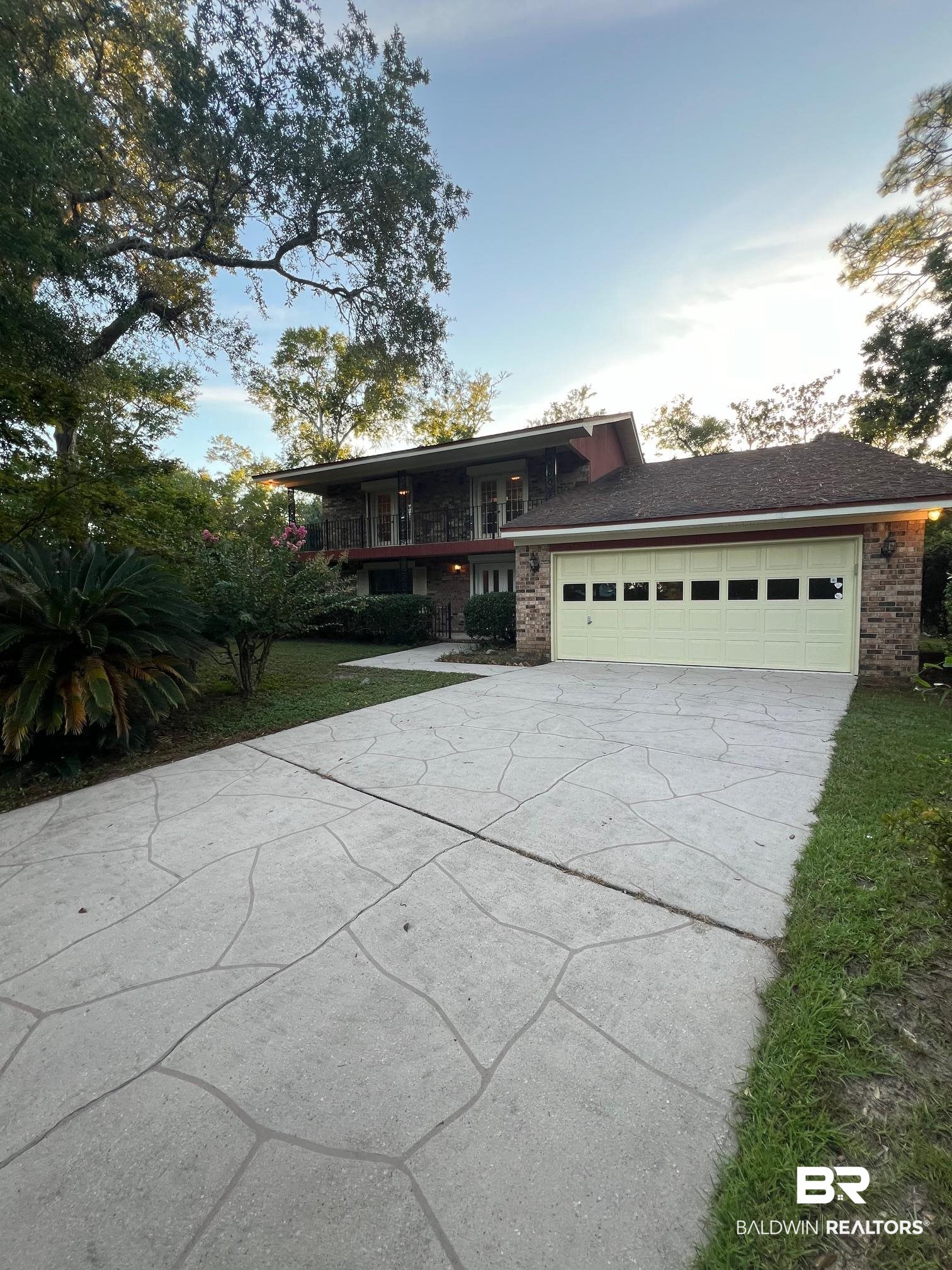 2240 Perdido Circle Lillian, AL 36549 - Photo 2 of 42 View of front of home featuring a garage and covered porch