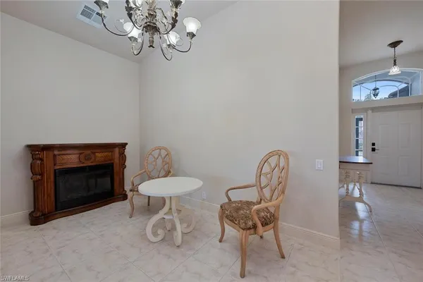 a dining room with furniture and a fireplace