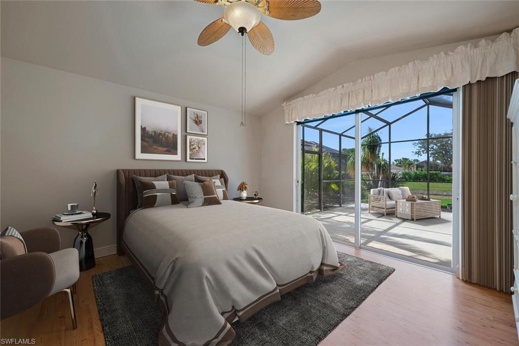 20241 Rookery Drive Estero, FL 33928 - Photo 19 of 33 Virtually Staged Bedroom featuring a sunroom, lofted ceiling, access to exterior, wood finished floors, and ceiling fan