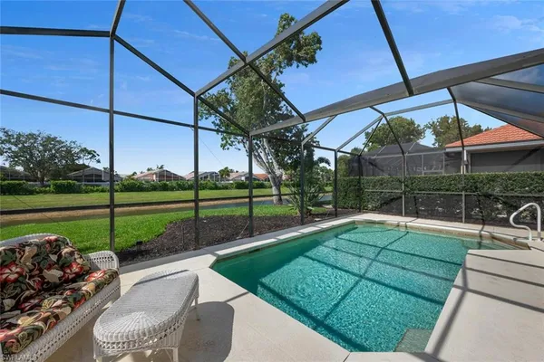 a view of a backyard with sitting area