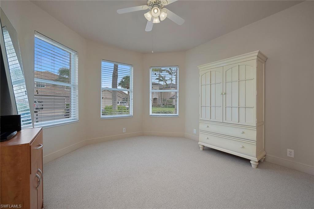 20241 Rookery Drive Estero, FL 33928 - Photo 22 of 33 Unfurnished bedroom with ceiling fan and light colored carpet