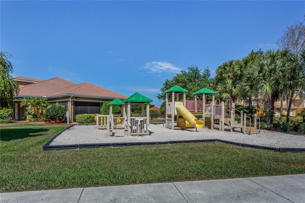 20241 Rookery Drive Estero, FL 33928 - Photo 29 of 33 Community play area featuring a yard