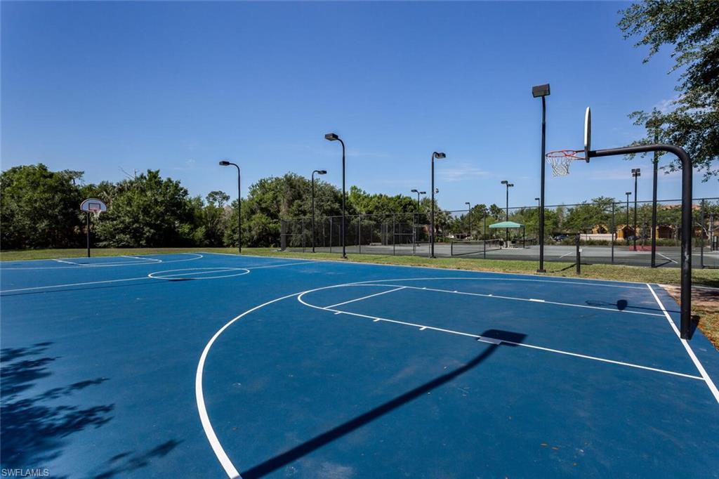 20241 Rookery Drive Estero, FL 33928 - Photo 30 of 33 View of basketball court with community basketball court and fence