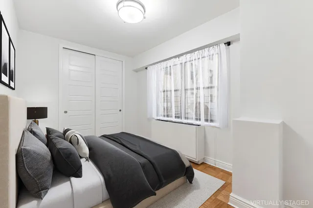 a bed room with a bed and a window