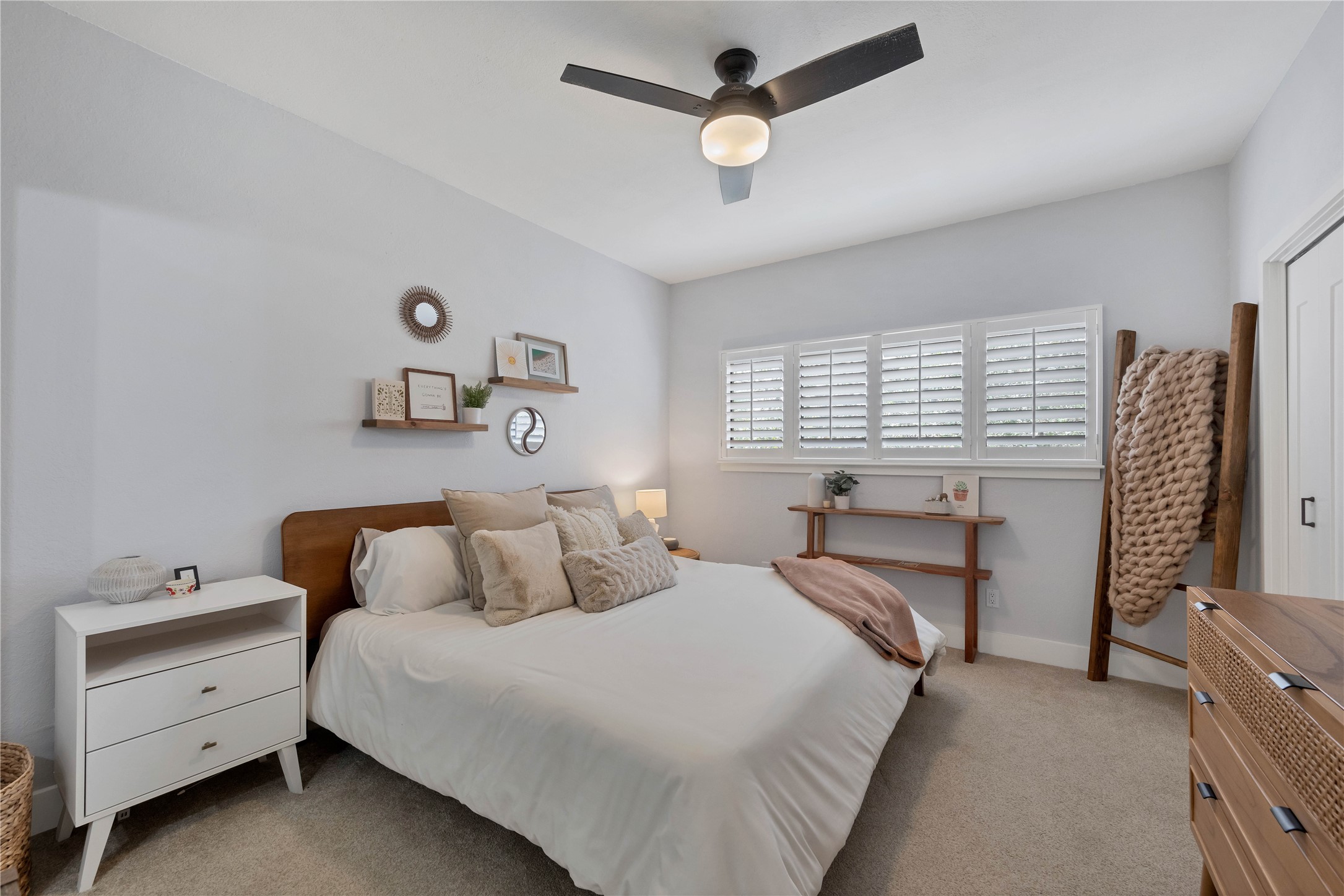 2605 Enfield Road, Unit 221 Austin, TX 78703 - Photo 14 of 30 Bedroom 1 comfortably fits a king-size bed, 2 nightstands, a dresser and a console table. Modern ceiling fan and plantation shutters.
