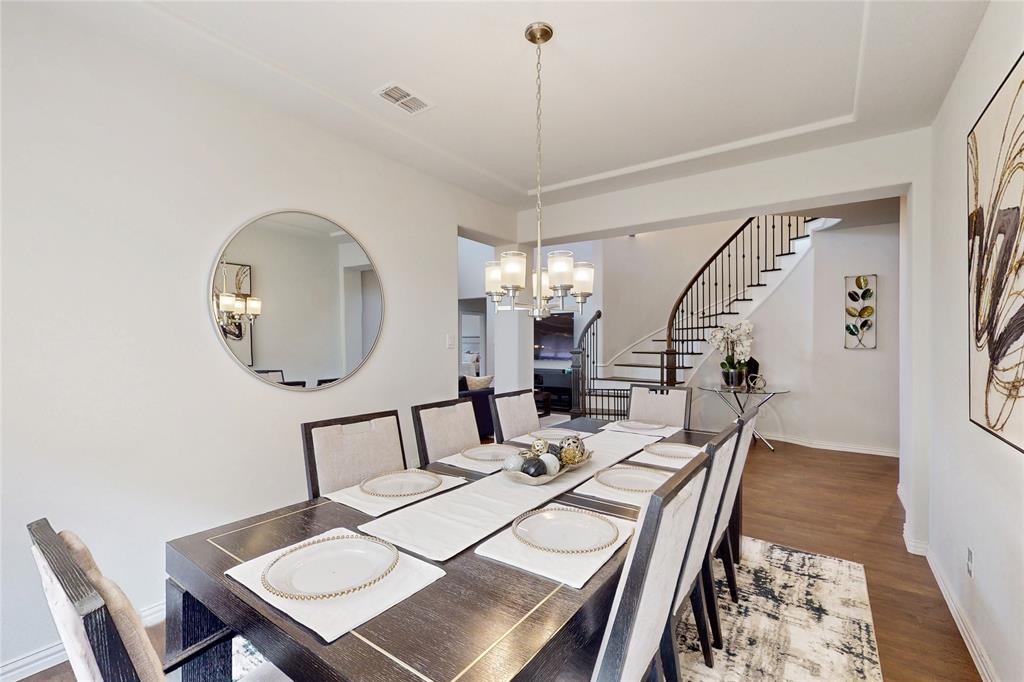 1997 Kieva Place Allen, TX 75013 - Photo 8 of 40 Dining room featuring dark wood finished floors and a chandelier