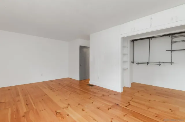a view of a big room with wooden floor