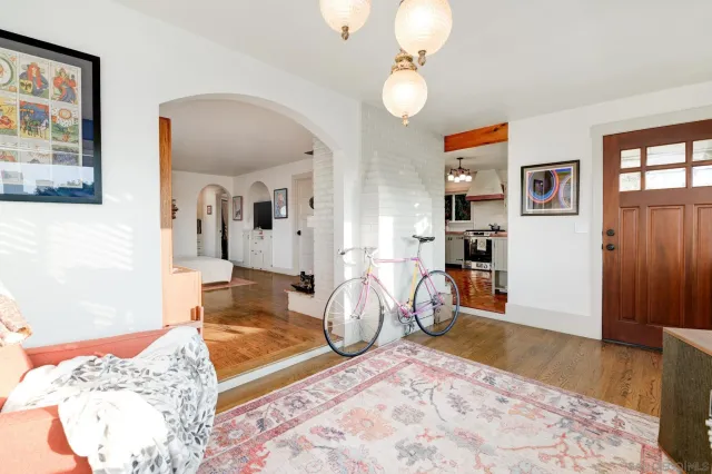 a view of a livingroom with furniture and a chandelier