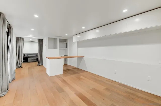 a kitchen with granite countertop a stove and a sink