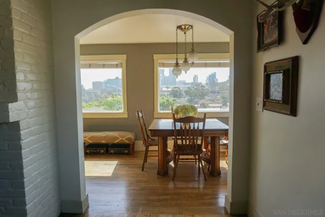 a view of a dining room with furniture window and outside view