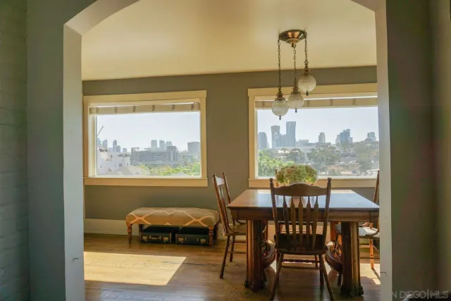 a view of a dining room with furniture window and outside view