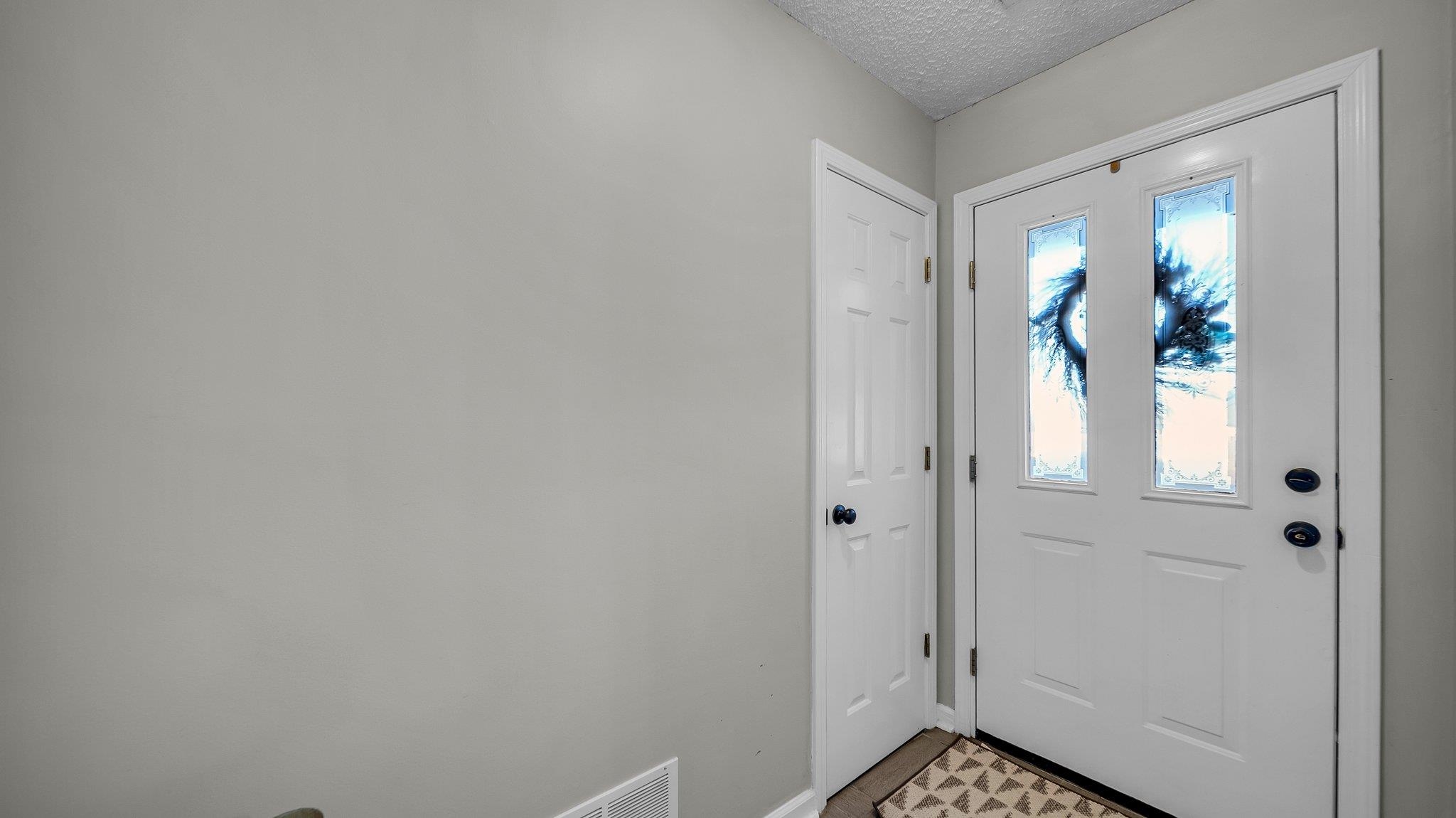 1415 Rosemark Road Atoka, TN 38004 - Photo 18 of 20 Tiled foyer featuring a textured ceiling