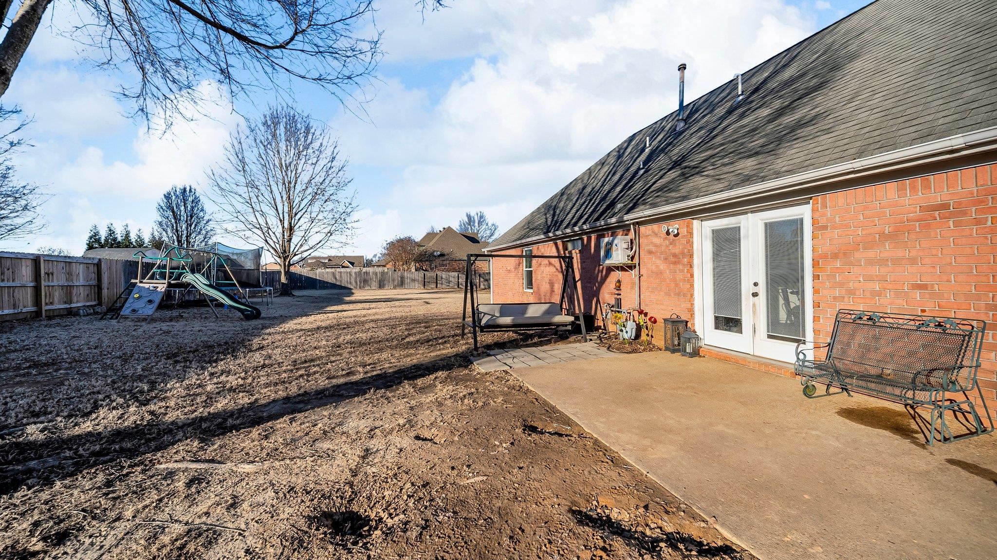 1415 Rosemark Road Atoka, TN 38004 - Photo 20 of 20 View of yard featuring a playground, a patio area, and french doors