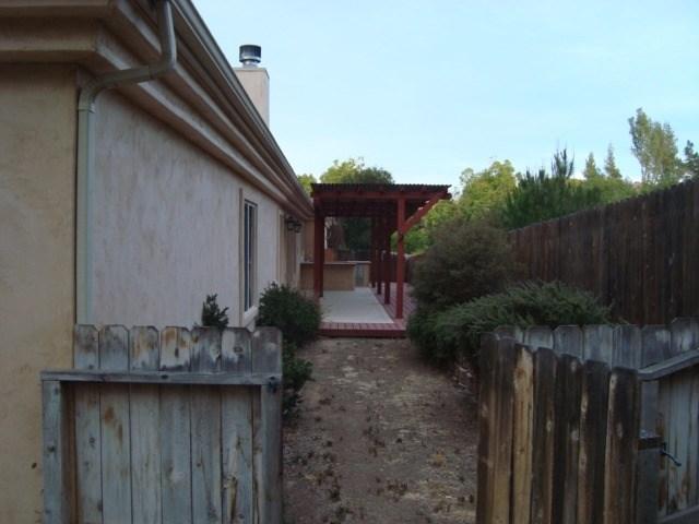 765 Alamo Pintado Road Solvang, CA 93463 - Photo 11 of 21 a backyard of a house with lots of green space