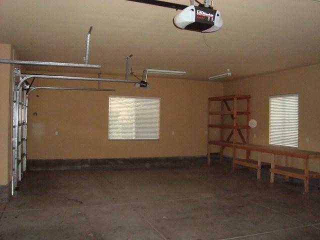 765 Alamo Pintado Road Solvang, CA 93463 - Photo 12 of 21 an empty room with windows and ceiling fan