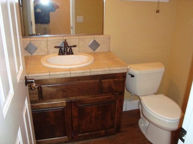 765 Alamo Pintado Road Solvang, CA 93463 - Photo 8 of 21 a bathroom with a sink a toilet and a mirror