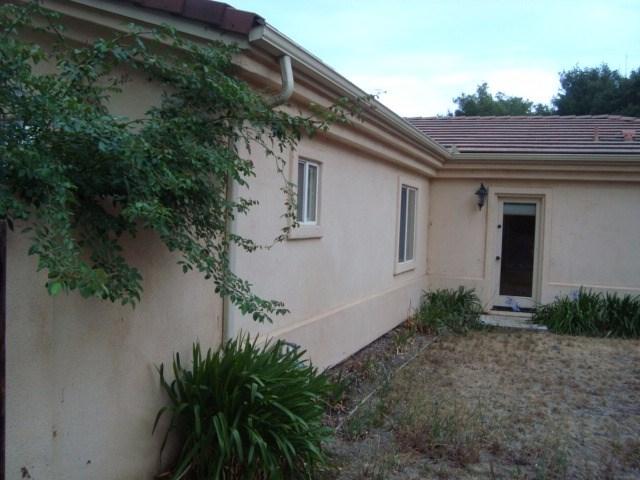 765 Alamo Pintado Road Solvang, CA 93463 - Photo 10 of 21 a backyard of a house with plants and trees