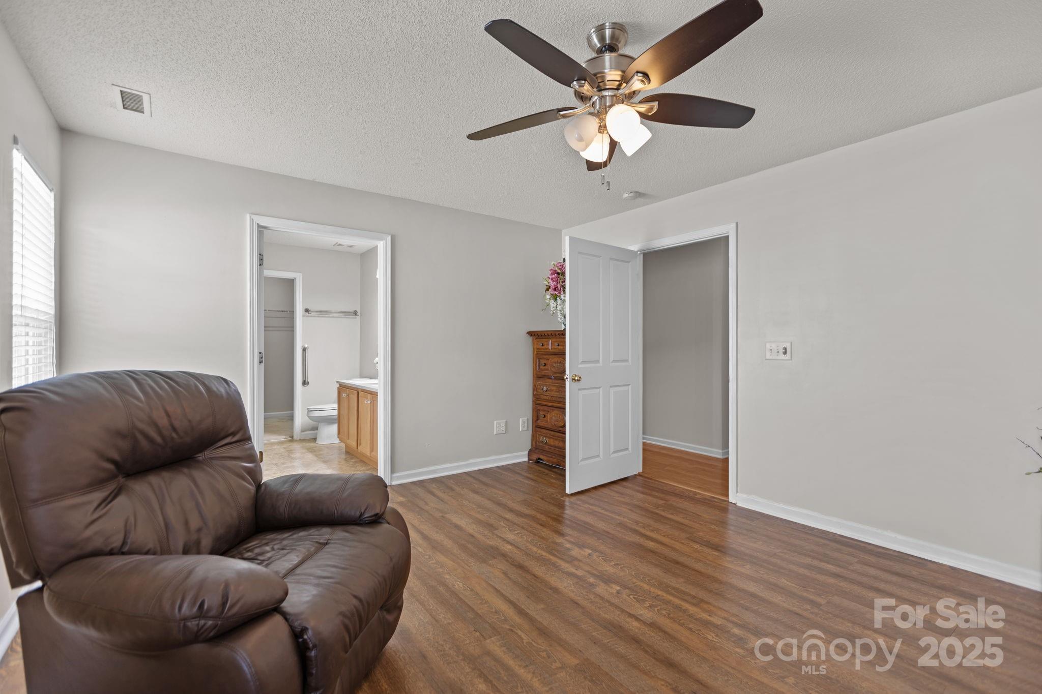 6839 Harter Court, Unit 35 Raleigh, NC 27610 - Photo 18 of 43 a living room with furniture and a ceiling fan