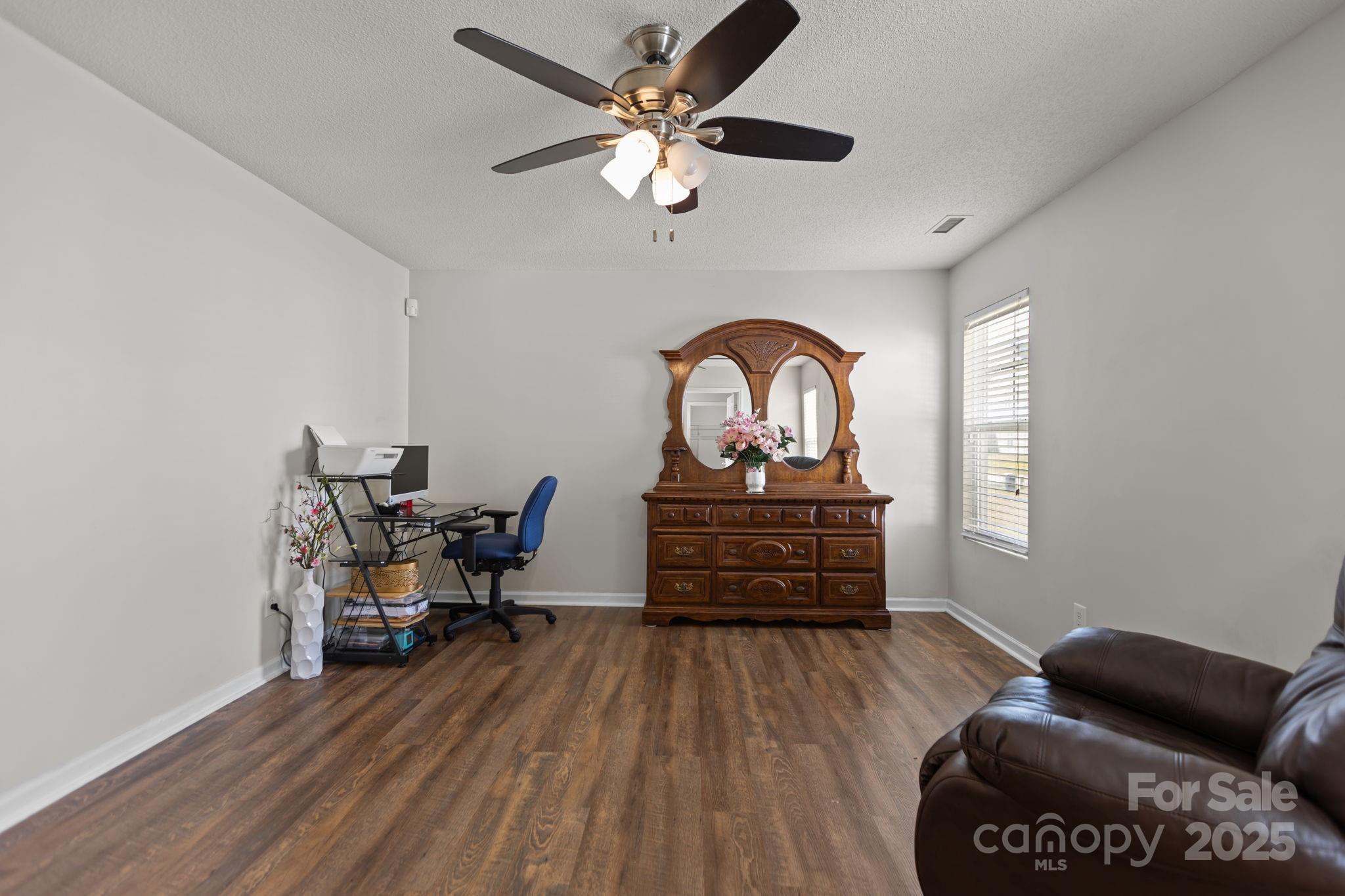 6839 Harter Court, Unit 35 Raleigh, NC 27610 - Photo 19 of 43 a living room with furniture and a wooden floor
