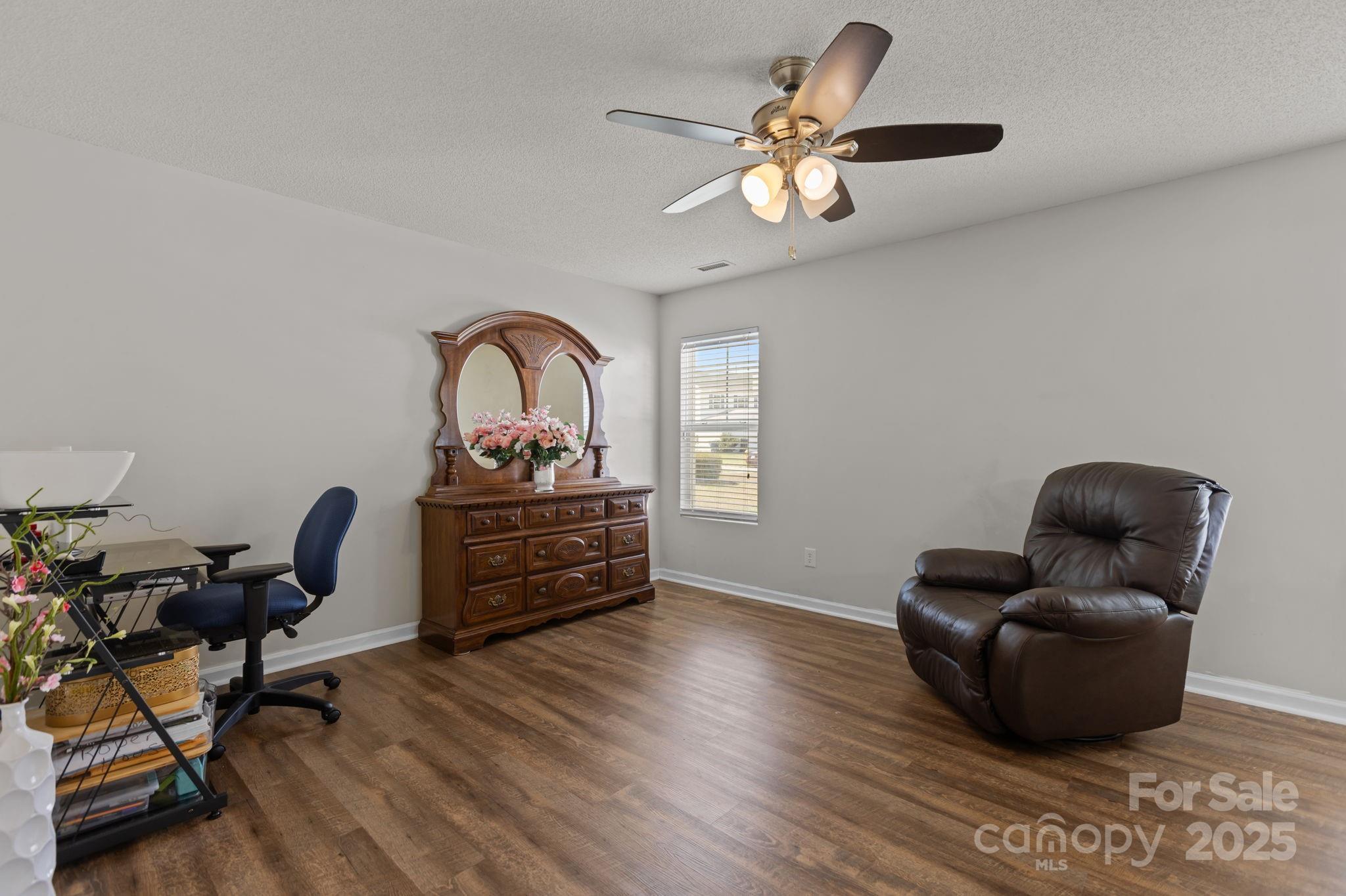 6839 Harter Court, Unit 35 Raleigh, NC 27610 - Photo 20 of 43 a living room with furniture and a wooden floor