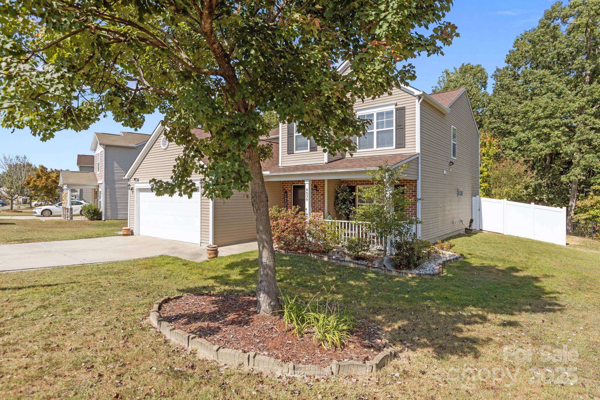 6839 Harter Court, Unit 35 Raleigh, NC 27610 - Photo 2 of 43 a front view of a house with garden
