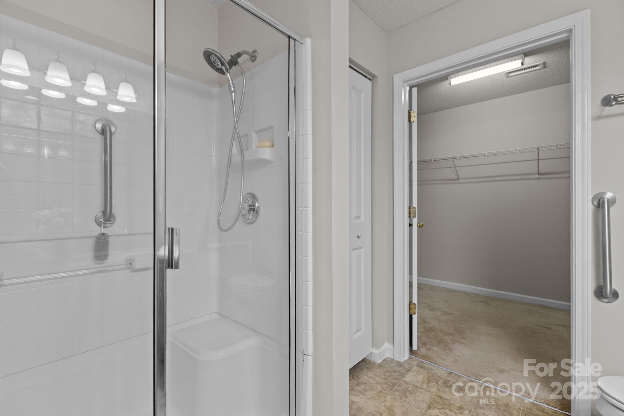 6839 Harter Court, Unit 35 Raleigh, NC 27610 - Photo 22 of 43 a bathroom with a glass shower door