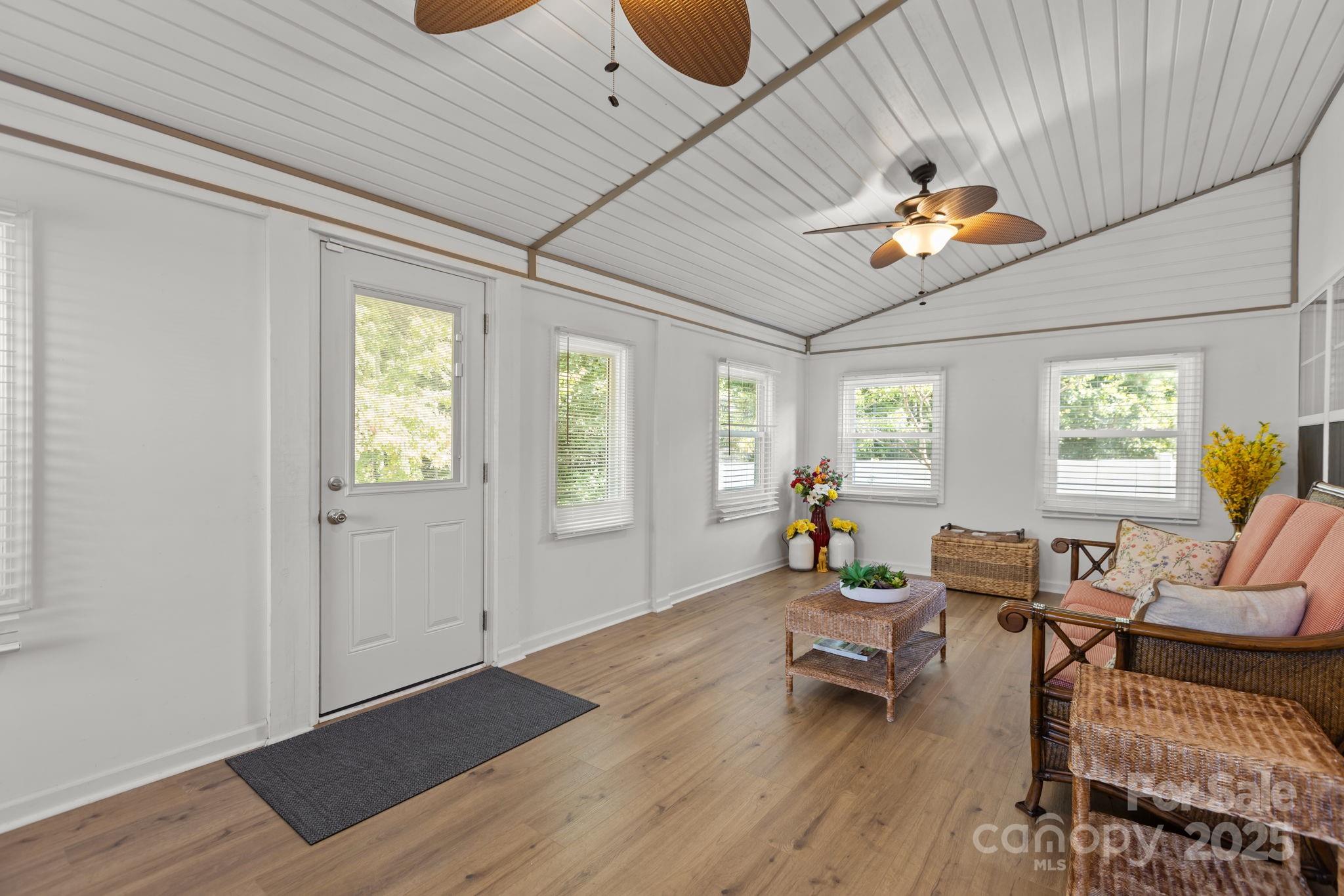 6839 Harter Court, Unit 35 Raleigh, NC 27610 - Photo 24 of 43 a living room with furniture and a wooden floor