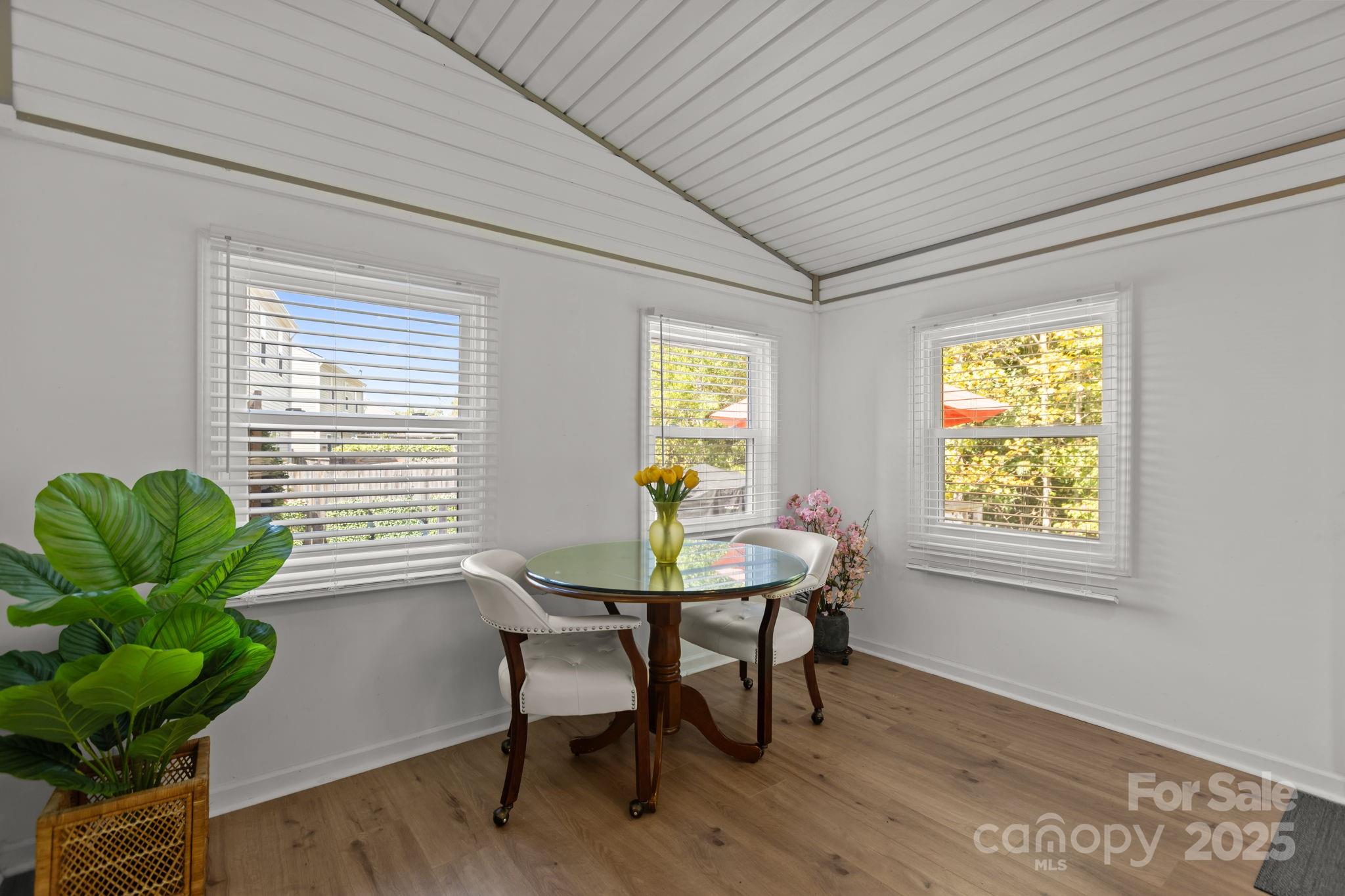 6839 Harter Court, Unit 35 Raleigh, NC 27610 - Photo 26 of 43 a dining room with furniture and wooden floor