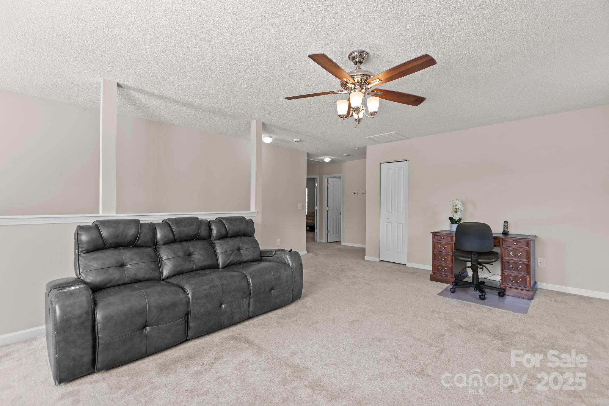 6839 Harter Court, Unit 35 Raleigh, NC 27610 - Photo 29 of 43 a living room with furniture