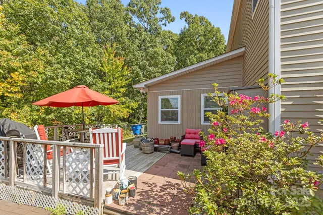 a view of a house with a flower garden