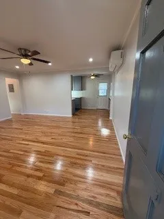 a view of a livingroom with wooden floor
