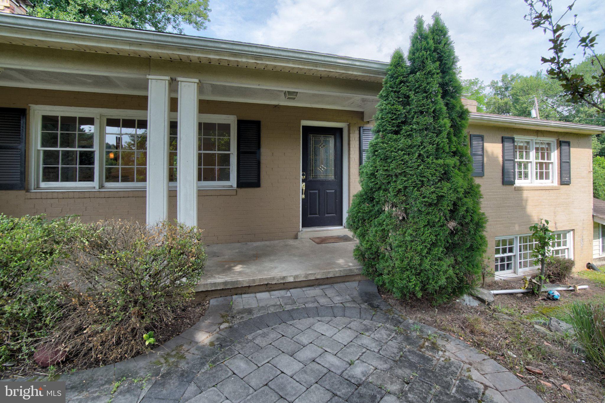 900 Walker Road Great Falls, VA 22066 - Photo 2 of 52 Charming entrance with lush greenery.