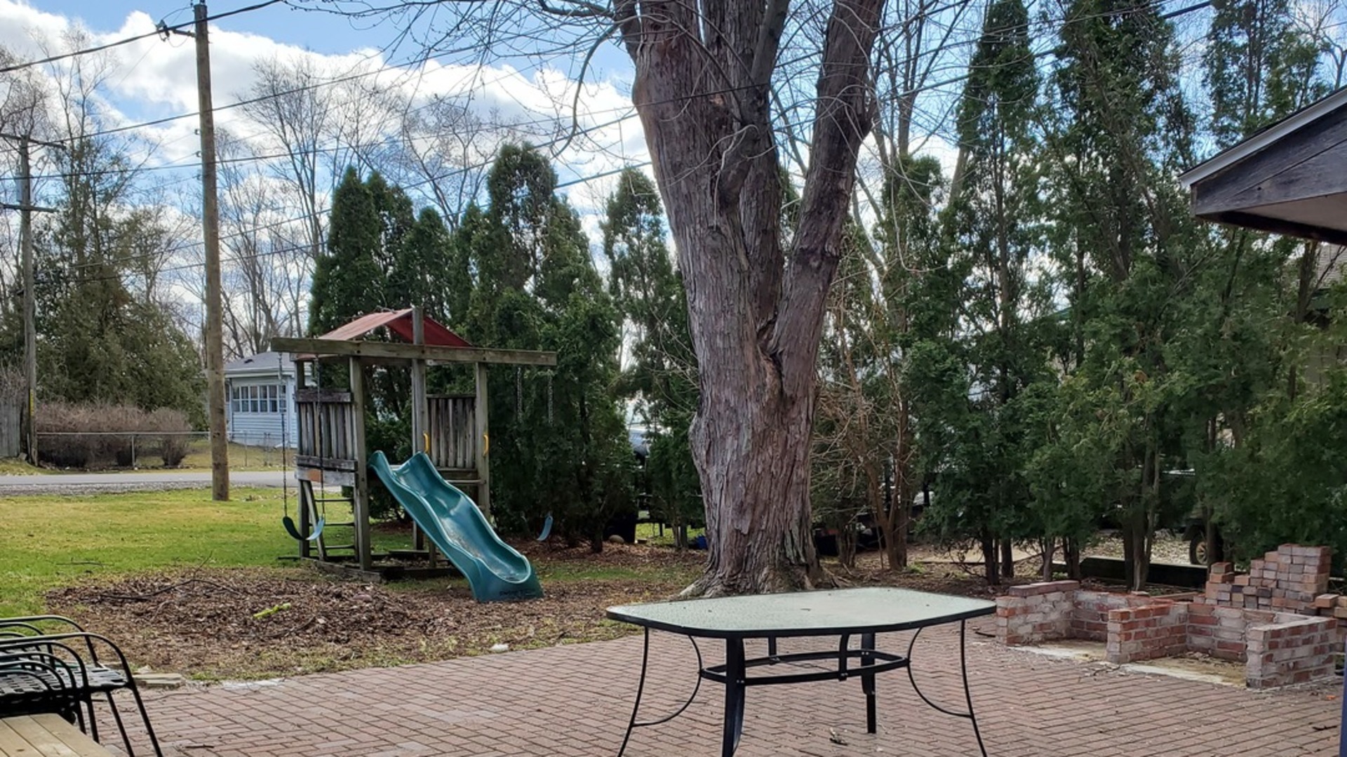 309 Kent Road McHenry, IL 60051 - Photo 21 of 25 a backyard of a house with barbeque oven table and chairs
