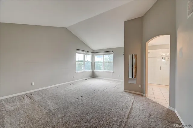 a bathroom with a double vanity sink mirror and shower