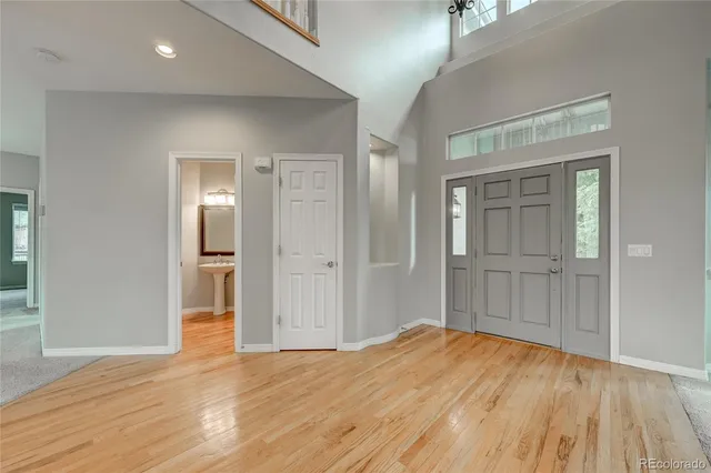 a kitchen with stainless steel appliances granite countertop a sink a stove a microwave a sink and cabinets