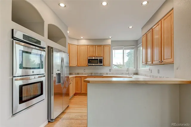 a kitchen with sink cabinets and microwave