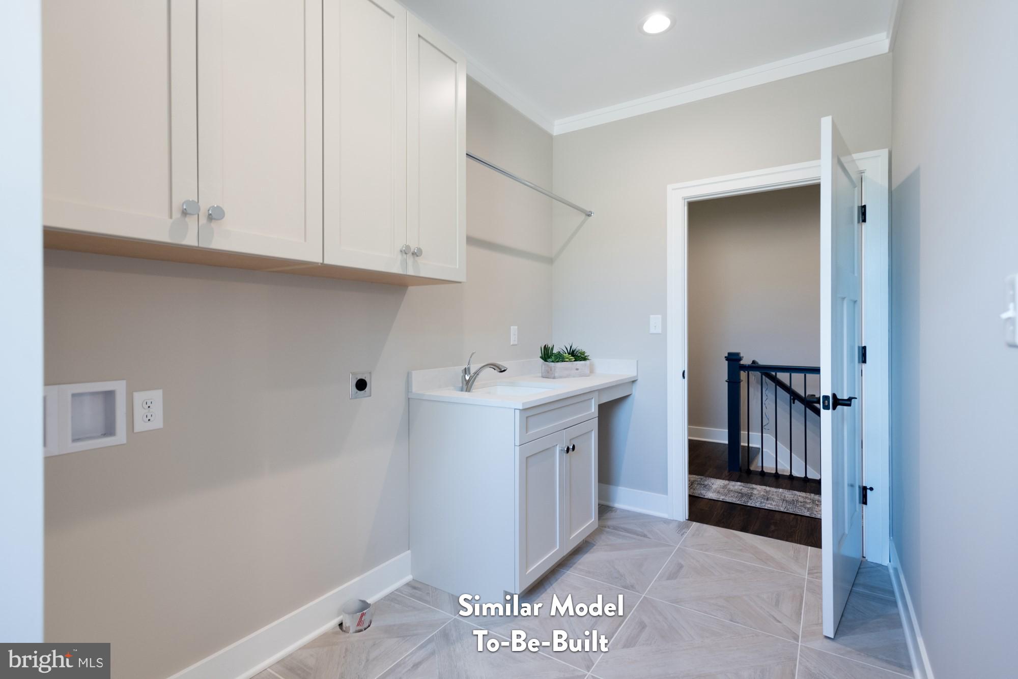 Lot#57 Patton Road Harrisburg, PA 17112 - Photo 11 of 11 a utility room with cabinets washer and dryer