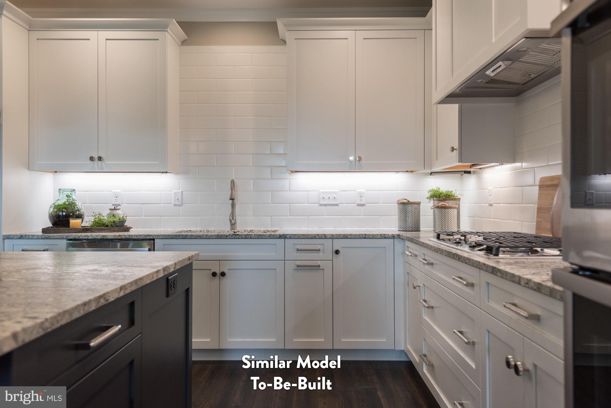 Lot#57 Patton Road Harrisburg, PA 17112 - Photo 5 of 11 a kitchen with granite countertop white cabinets and white appliances