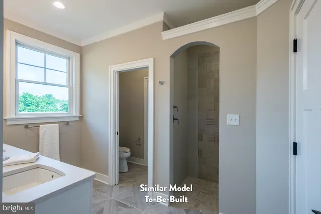 a view of entryway with bathroom