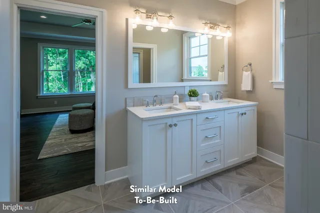 a bathroom with a double vanity sink and a mirror
