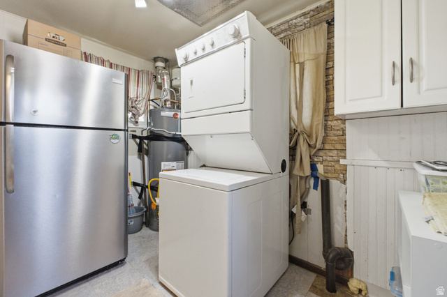 94 West 2000th Street North Clearfield, UT 84015 - Photo 15 of 26 Additional utility room view showing laundry setup, water heater, storage space, and functional layout.
