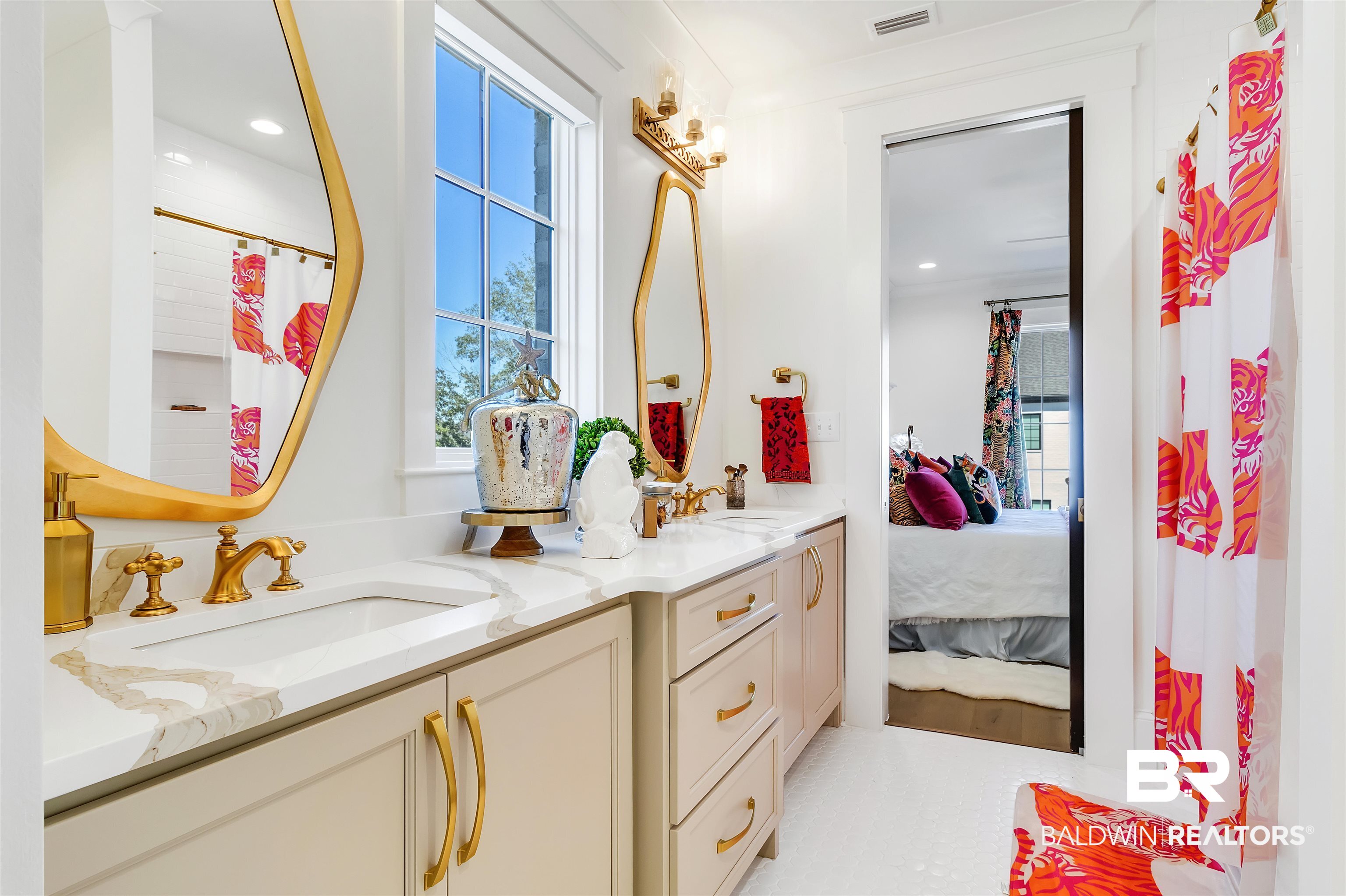 885 Inlet Circle Gulf Shores, AL 36542 - Photo 29 of 36 Bathroom featuring vanity, ornamental molding, a wealth of natural light, and a shower with curtain