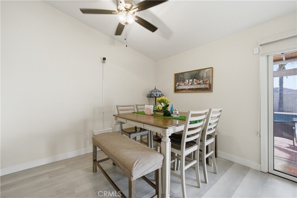 29739 Berea Road Menifee, CA 92584 - Photo 12 of 25 a view of a dining room with furniture and a chandelier fan
