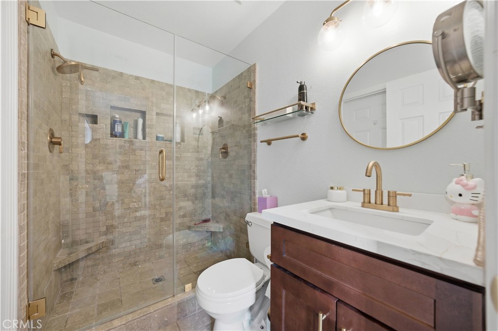 29739 Berea Road Menifee, CA 92584 - Photo 16 of 25 a bathroom with a sink a toilet and shower