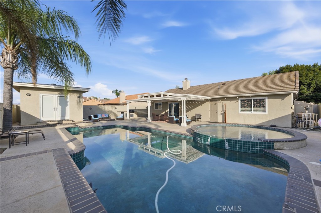 29739 Berea Road Menifee, CA 92584 - Photo 21 of 25 a view of a house with pool and sitting area