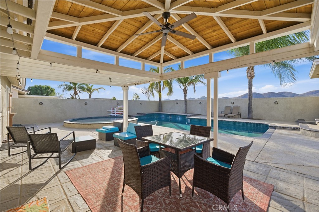 29739 Berea Road Menifee, CA 92584 - Photo 22 of 25 a view of a patio with a table and chairs under an umbrella