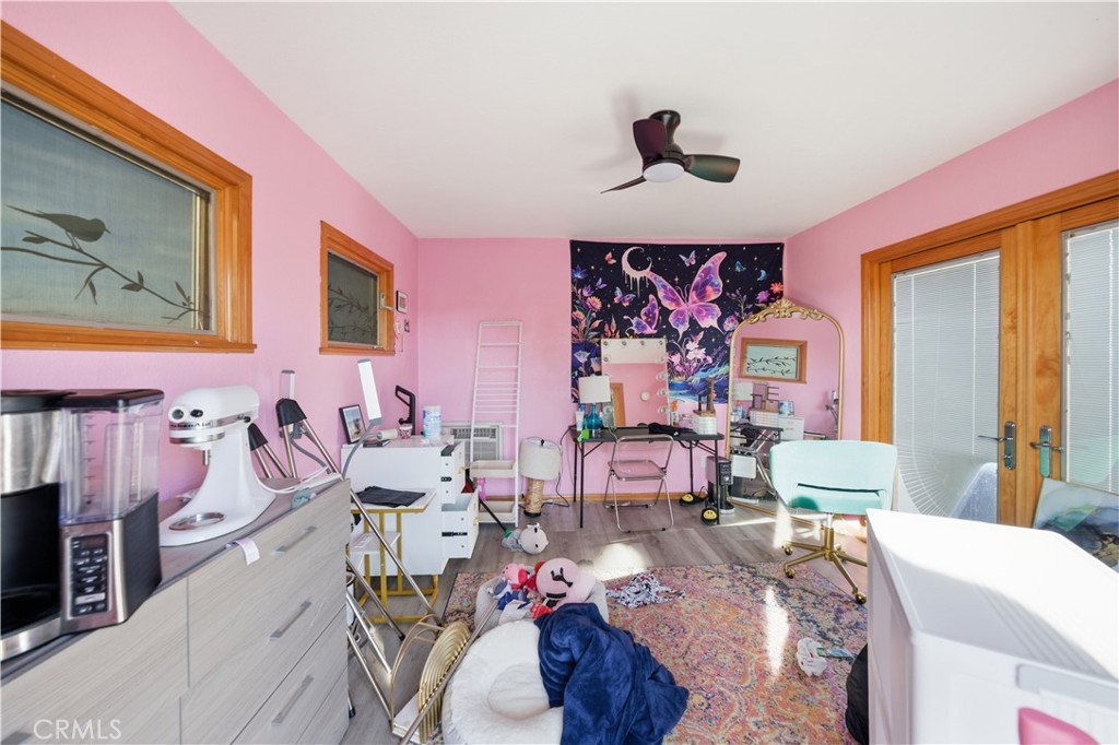 29739 Berea Road Menifee, CA 92584 - Photo 24 of 25 a view of a livingroom with furniture window and wooden floor